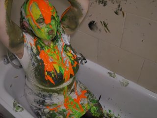 BBW in white dress covers herself in paint from head to toe sploshing