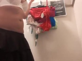 Trying on tight bikinis in store fitting room