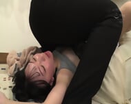 A petite woman, Mari Kago, blushes and is left breathless as she is pressed down by a giant man in a deep kiss, receiving a deep, oxygen-deprived cumshot