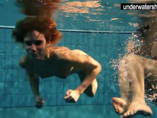Two sexy amateurs showing their bodies off under water