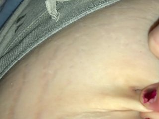 Woman moaning and playing with soft bellybutton
