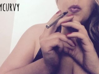 Blonde Carlycurvy vaping and playing in a short leather dress