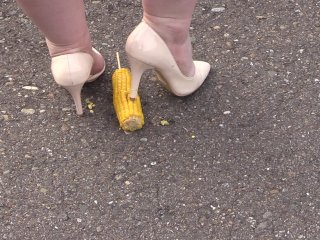 Crush-fetish. Thick legs in heels crushed the corn mercilessly.