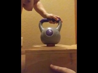 Wife crushes balls with kettle bells