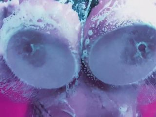 Hot chick washing her boobs in a foamy shower