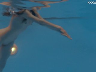 Petite Russian Marfa swims nude in the pool