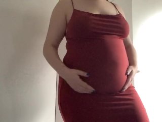 Round fat belly in a red dress