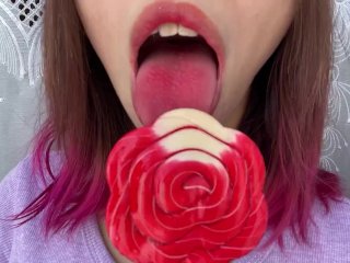 Naughty stepsister sucks a lollipop and show her long hot sexy tongue