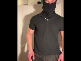 Young hunk strips in balaclava